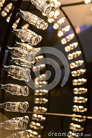 Empty Coca Cola bottles are arranged in a shape Editorial Stock Photo