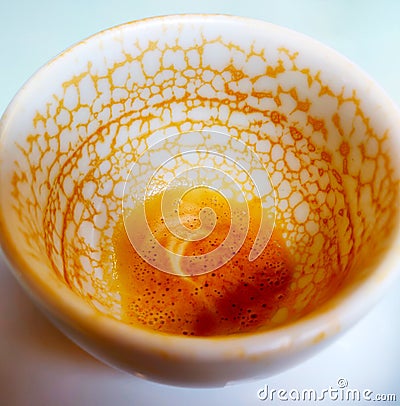 An empty coffee cup after drinking with coffee residue pattern Stock Photo