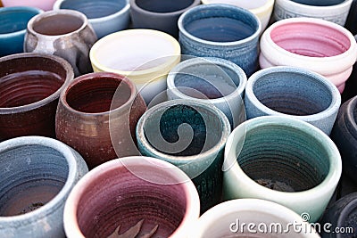 Empty colourful ceramic flower pots in greenhouse or hothouse Stock Photo