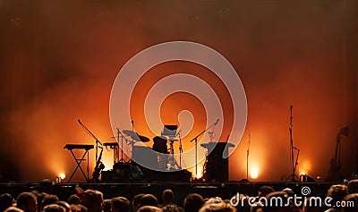 Concert stage on music festival, instruments silhouettes, microphones drums guitars Editorial Stock Photo