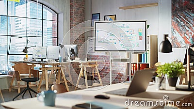 Empty Conference Room for Team Meetings in Modern Creative Agency with Art on Walls and Desks with Stock Photo