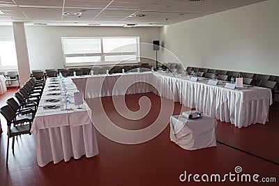 Empty congress room before seminar, bottles of mineral water on table Stock Photo