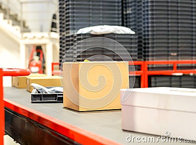 Cardboard boxes on conveyor belt.parcels transportation system concept Stock Photo