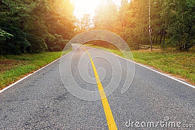 Empty country road at sunset Stock Photo