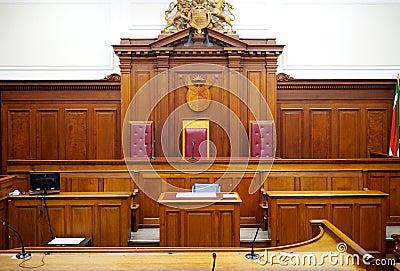 Empty courtroom, with old wooden paneling Stock Photo