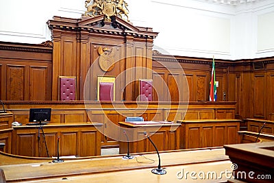 Empty courtroom, with old wooden paneling Stock Photo