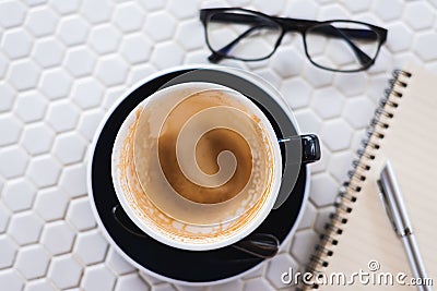 Empty a cup of coffee on white table Stock Photo