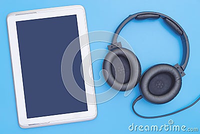 Empty digital tablet with headphone for Music and Movie mock up Stock Photo