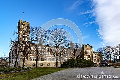 Empty esplanade with old main building of former Waterschei mine in background Stock Photo