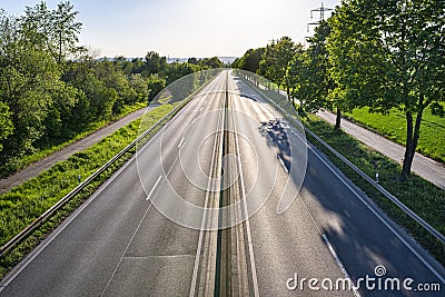 An empty expressway in Germany in the middle of the day due to the COVID-19 coronavirus pandemic. Stock Photo