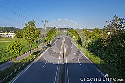 An empty expressway in Germany in the middle of the day due to the COVID-19 coronavirus pandemic. Stock Photo