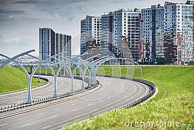 Empty expressway of the western high-speed diameter in st. petersburg in clear sunny weather, green lawns along the road Stock Photo