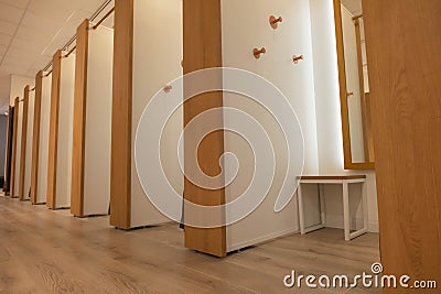 empty fitting rooms in brown and white in a store of things. there is a place for an inscription Stock Photo