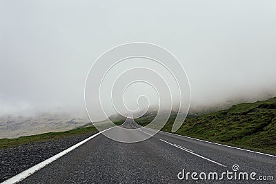 Empty foggy and misty asphalt road through the the mountain, no Stock Photo