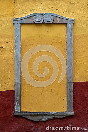 Empty frame Rustic Colonial mexican street, stone frame yellow and red wall. Stock Photo