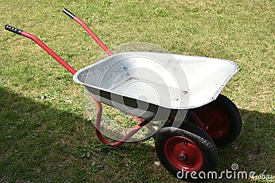 An empty garden iron cart in a summer park Stock Photo