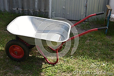 An empty garden iron cart in a summer park Stock Photo