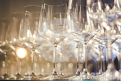 Empty glass glasses on the shelf, abstract background and texture, image with soft focus Stock Photo