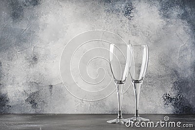 Empty glasses for champagne or sparkling wine, gray background, copy space, selective focus Stock Photo