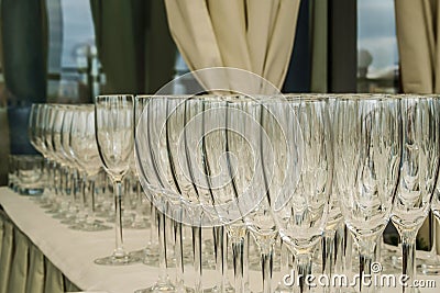 Empty glasses rows on the table in restaurant Stock Photo