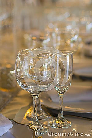 Glasses of water, wine and champagne arranged on a wedding reception Stock Photo