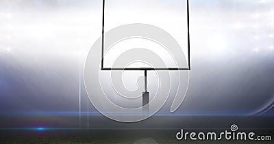 Empty goal post against illuminated bright american football sports field at night Stock Photo