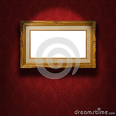 Empty golden frame on the wall. Stock Photo