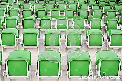 Empty green seats at stadium Stock Photo