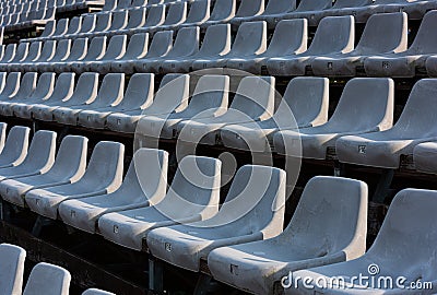 Empty grey seats on a seating tribune Stock Photo