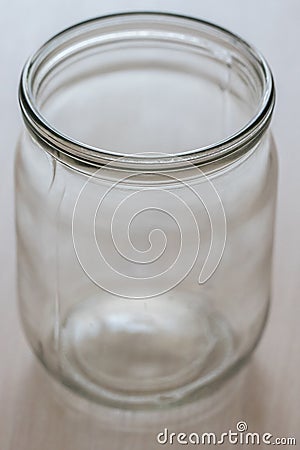 Empty half-liter glass jar on the table closeup Stock Photo