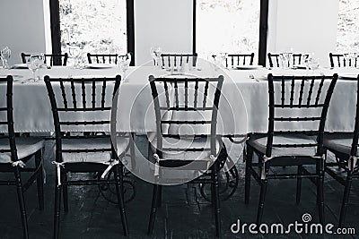 Empty hall of the restaurant. A table is served awaiting guests. Pandemic of new coronavirus crippling restaurant business Stock Photo