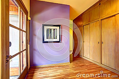 Empty hallway with bright purple wall Stock Photo