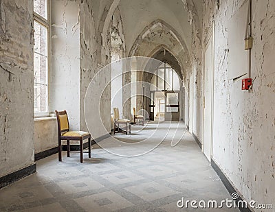 Empty hallway with chairs in an abandoned monastery Editorial Stock Photo