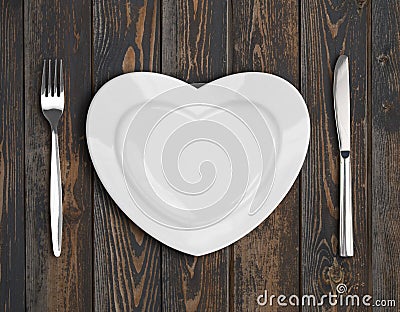 Empty heart plate top view on wood table Stock Photo