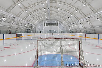 empty hockey field, arena with ice and markings and gates Stock Photo