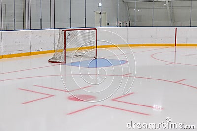 empty hockey field, arena with ice and markings and gates Stock Photo
