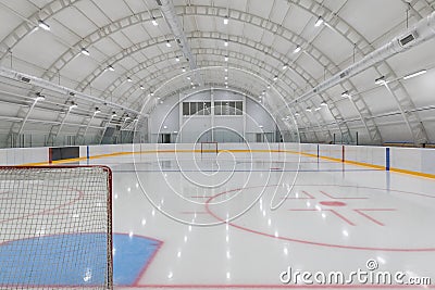 empty hockey field, arena with ice and markings and gates Stock Photo