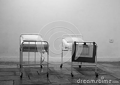 Empty hospital beds standing in abandoned room for patients Editorial Stock Photo