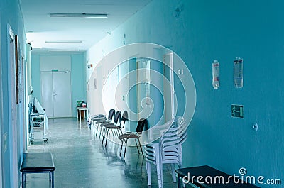 Empty hospital hallway. Close up. Rays of light in the corridor of the hospital. waiting wheelchair. quarantine isolation. epidemi Stock Photo