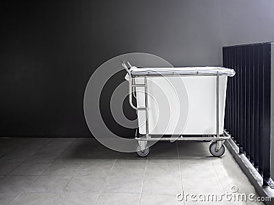 Empty hotel housekeeping maid laundry trolley. Stock Photo