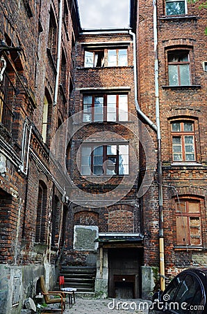 Empty inner backyard of old abandoned buildings Stock Photo