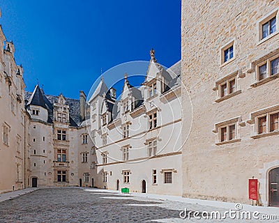 Empty inner courtyard of the ChÃ¢teau de Pau against blue sky, in the city centre of Pau, France Stock Photo