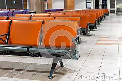 Empty international airport building during pandemic. Empty seat rows at airport lounge Stock Photo