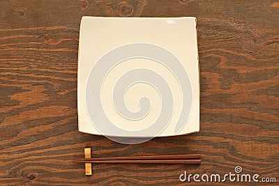 Empty Japanese dish with chopsticks Stock Photo