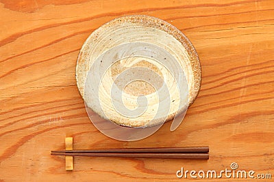 Empty Japanese dish with chopsticks Stock Photo