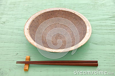 Empty Japanese dish with chopsticks Stock Photo