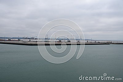 Empty Le Havre Port in France with uplifted gantry cranes without movement due to reduced traffic Stock Photo