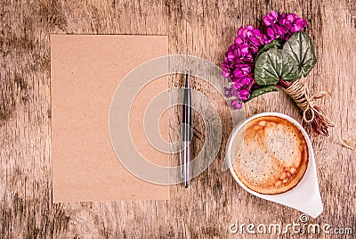 Empty letter, a cup of coffee and flowers. Romantic concept. Stock Photo