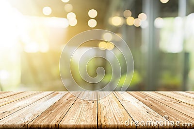 Empty light wood table top with blurred in coffee shop background Stock Photo