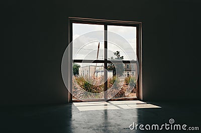 Empty loft interior of a building with a view of the city of Marfa, Texas Stock Photo